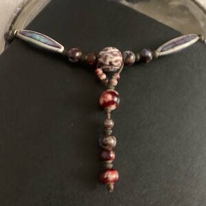 Red and Brown Necklace with Central Focal Point and Elongated Beads